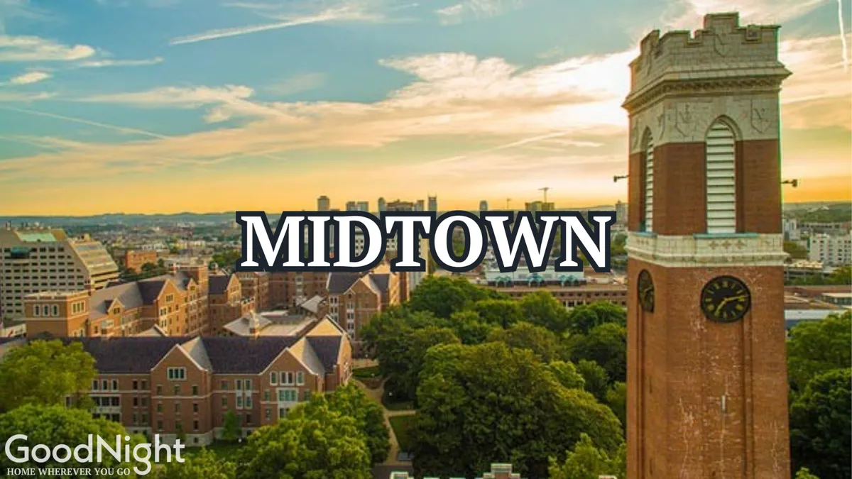 This exterior image captures the iconic clock tower, lush greenery, and the Nashville skyline, offering a vibrant sense of place and the urban energy that business travelers can tap into while exploring Music City. The open park space and lively backdrop hint at accessibility to city highlights and after-hours leisure activities.